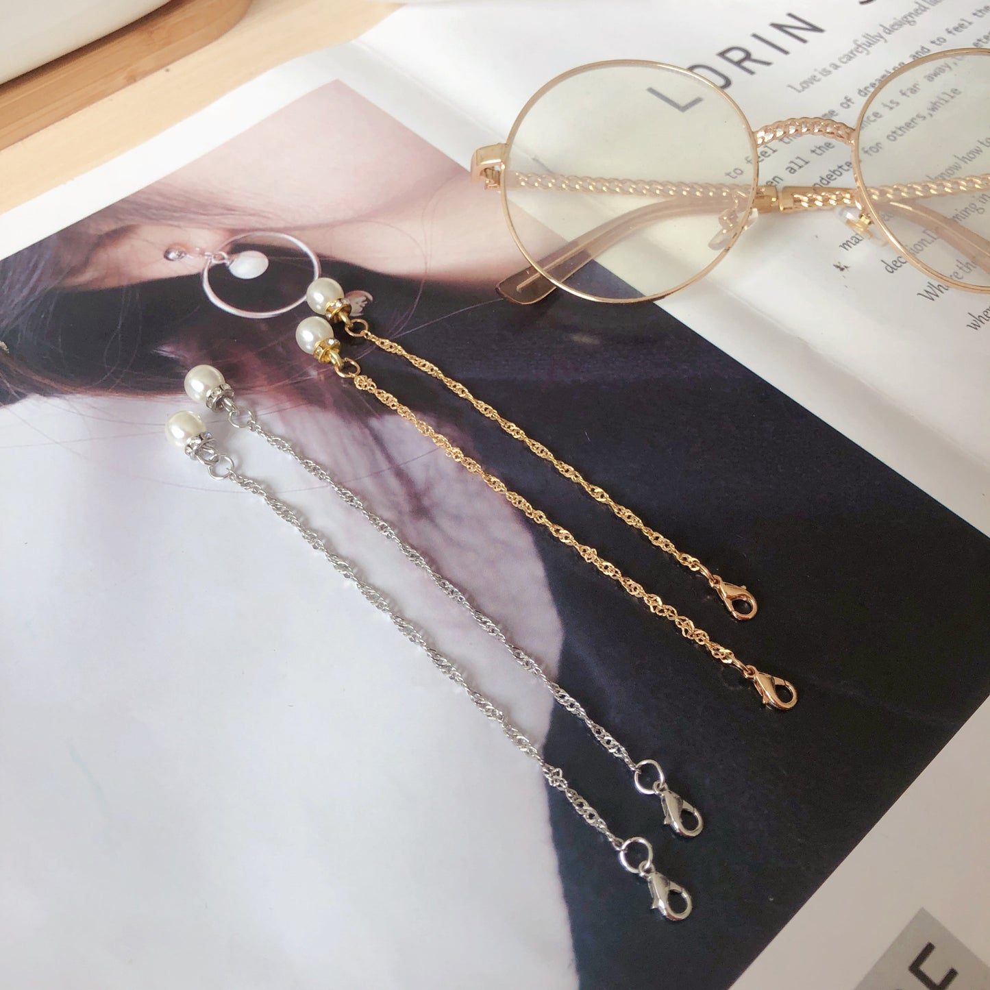 Elegante Anhängerohrringe mit Perlenakzenten Brehn