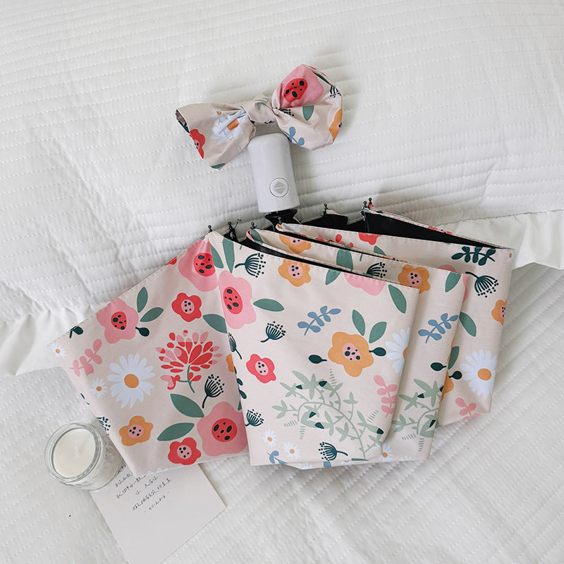 Damen Faltbarer Regenschirm mit floralem Design und niedlichen Details Brehn