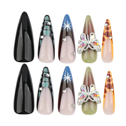 Kunstvolle Nagelverlängerungen mit eleganten Designs und Glitzer Brehn