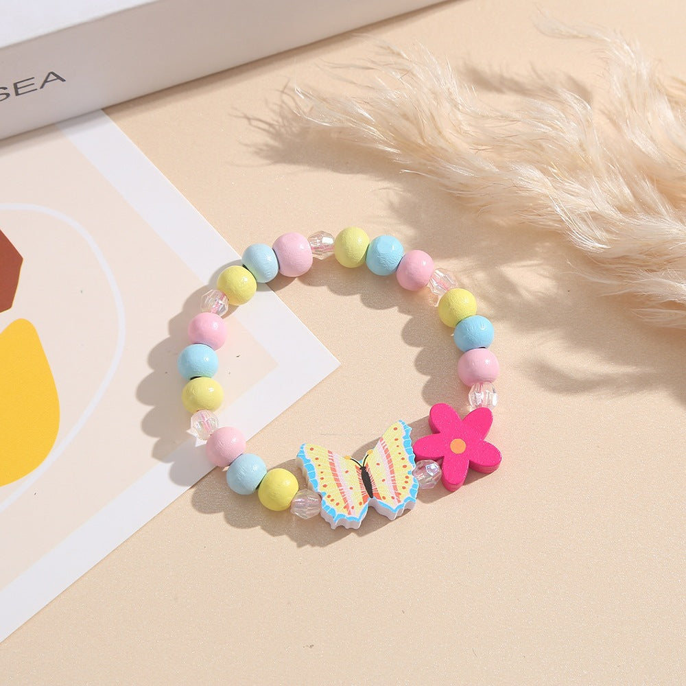 Verspieltes Armband mit Herz- und Schmetterlings-Anhängern Brehn