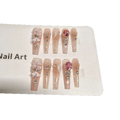 Dekoratives Press-On Nagelkunst-Set mit eleganten Blumen- und Strass-Akzenten