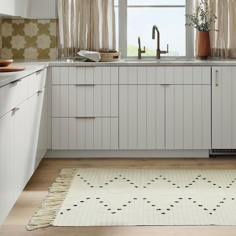 handgewebter Wohnzimmer-Teppich mit Fransen und geometrischem Lochmuster Brehn