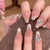 Kunstnagelset mit filigranen Spitzendesigns und glamourösen Strassakzenten Brehn