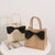 Elegante Basttasche mit Schleifendetail Brehn