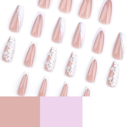 Kunstvolle Nagelverlängerungen mit Herzdesign und Glitzerakzenten Brehn