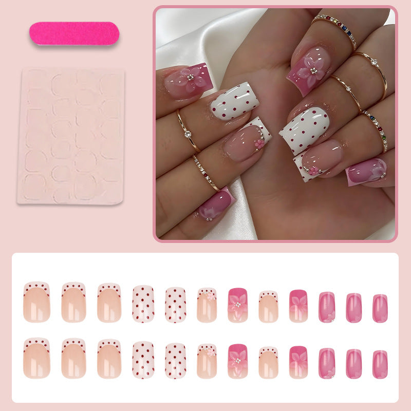 Kunstnagelset mit verspielten Blüten- und Punktmotiv Brehn