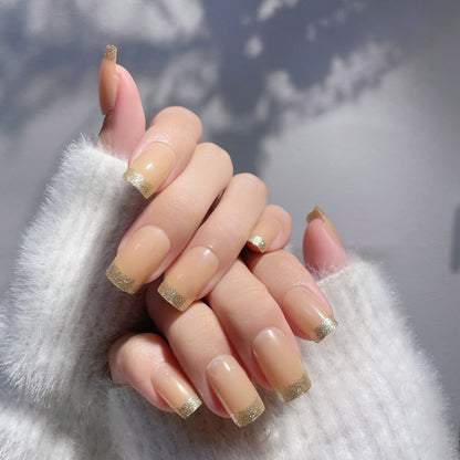 Elegantes Set von French Tip Press-On Nägeln mit Glitzerakzenten