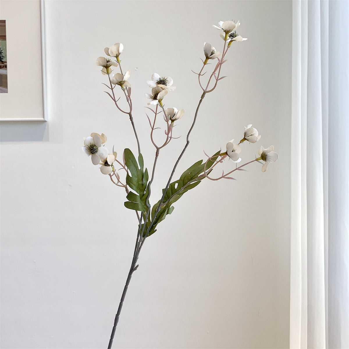 Dekorativer künstlicher Blumenzweig