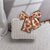 Damen eleganter Handtasche aus geflochtenem Material Brehn