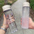 Damen tragbare Wasserflasche mit praktischem Reinigungssystem Brehn