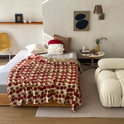 Gemusterte Wohndecke mit gewebten Blumenapplikationen