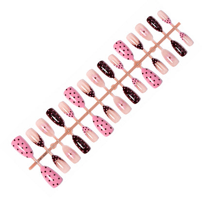 Kunstnagelset mit verspielten Punkten und floralen Akzenten Brehn