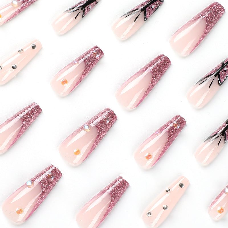 Kunstvolle Stiletto-Nägel mit floralen und glitzernden Akzenten Brehn