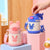 Damen Isolierte Kindertrinkflasche mit praktischem Tragegurt Brehn