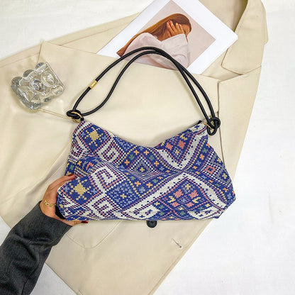 Gepunktete Schultertasche