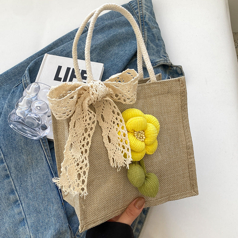 Blumenverzierte Tasche