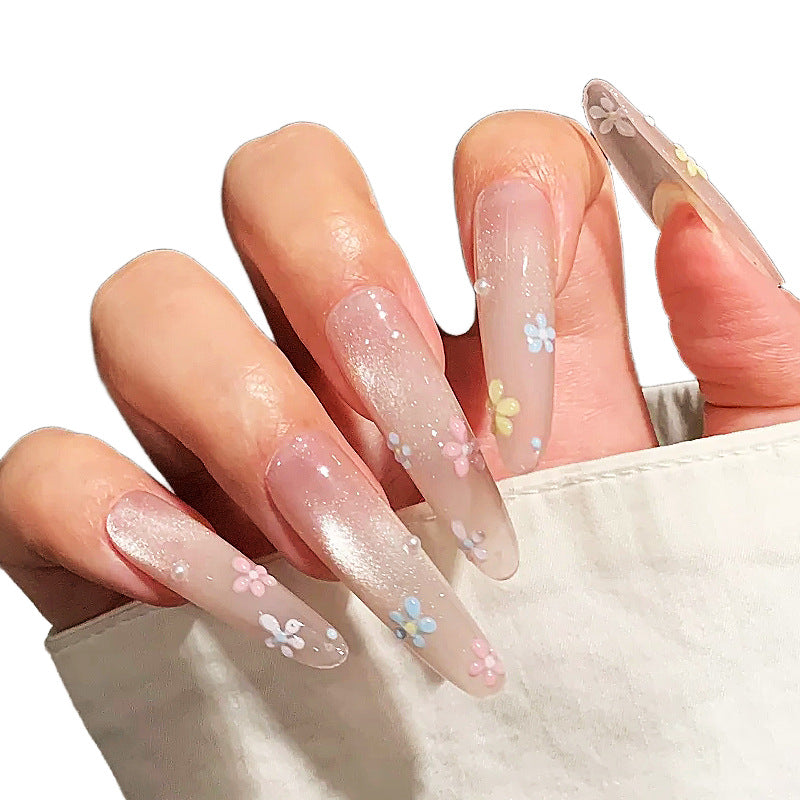 Lange Acryl Press-On Nägel mit floralen Verzierungen Brehn
