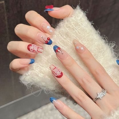 Künstlerisches Press-On-Nagelset mit dekorativen Kirschen und Sternelementen