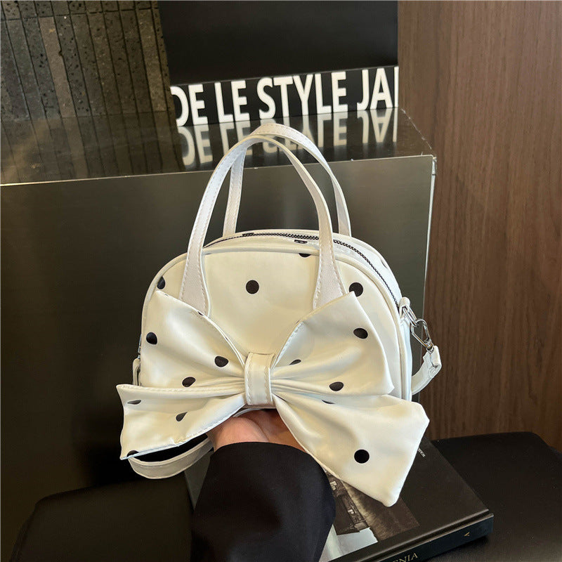 Schleifenverzierte Handtasche