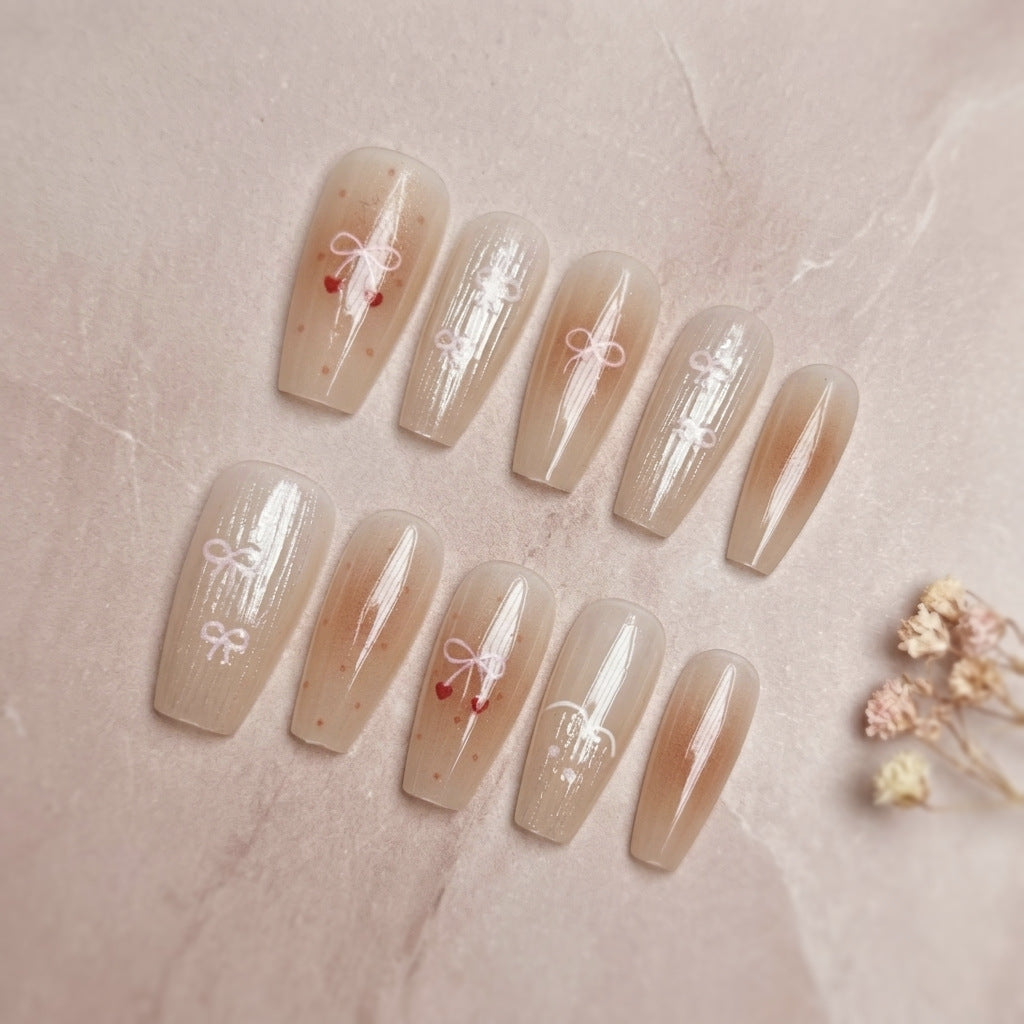 Dekorativer Press-On-Nagelset mit eleganten Schleifenmustern