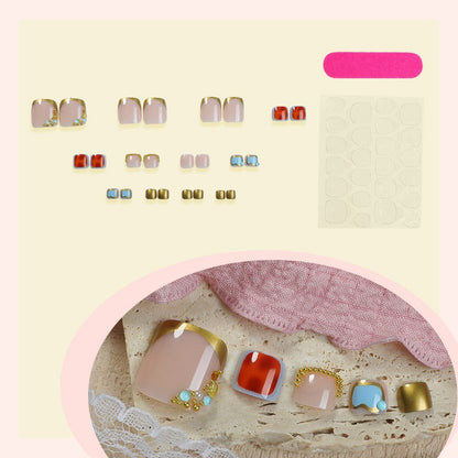 Kunstnagelset mit eleganten goldenen Akzenten Brehn