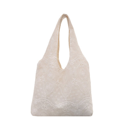 Elegante Handtasche mit Spitzenbesatz