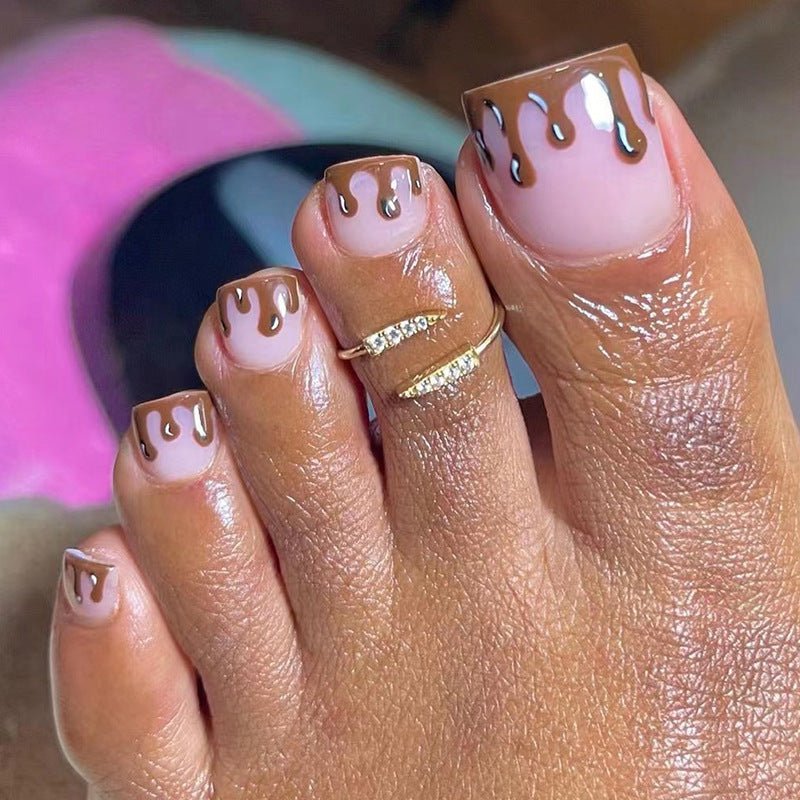 Kreative Fußnagelkunst im Schokoladenglasur-Design Brehn