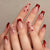 Kunstnagelset mit romantischen Herzen und eleganten Schleifen Brehn