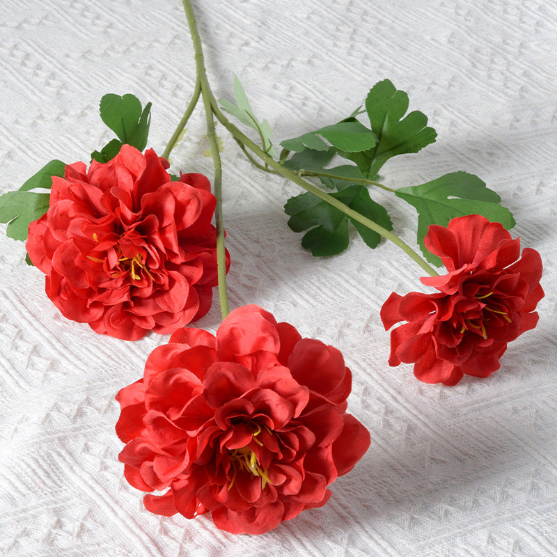 Künstliches Blumenarrangement mit Ringelblumen