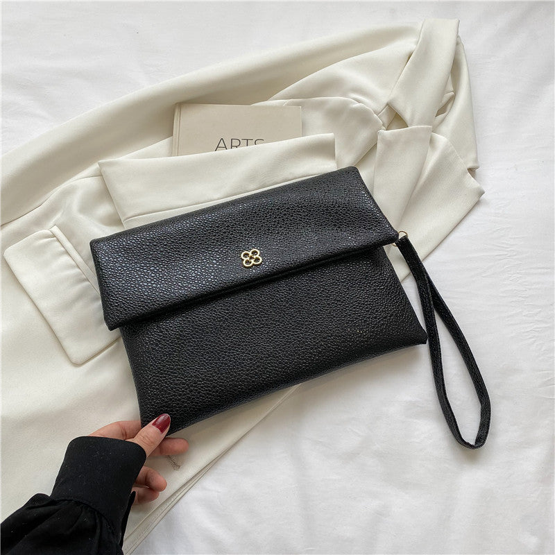 Elegante Texturierte Handgelenk-Clutch Brehn