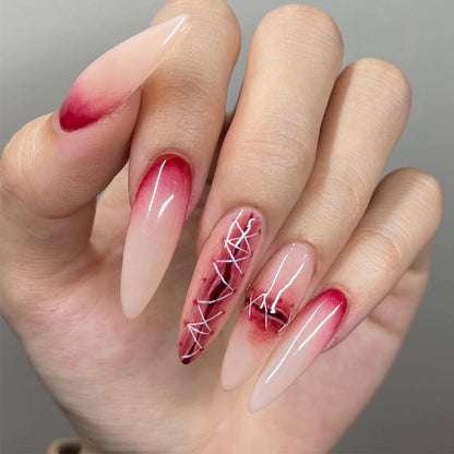 Kunstvolle Nagelverlängerungen im eleganten Ombre-Stil mit Kunstmotiv Brehn