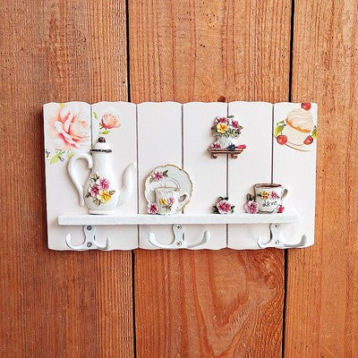 Dekorativer floral Wandhakenregal