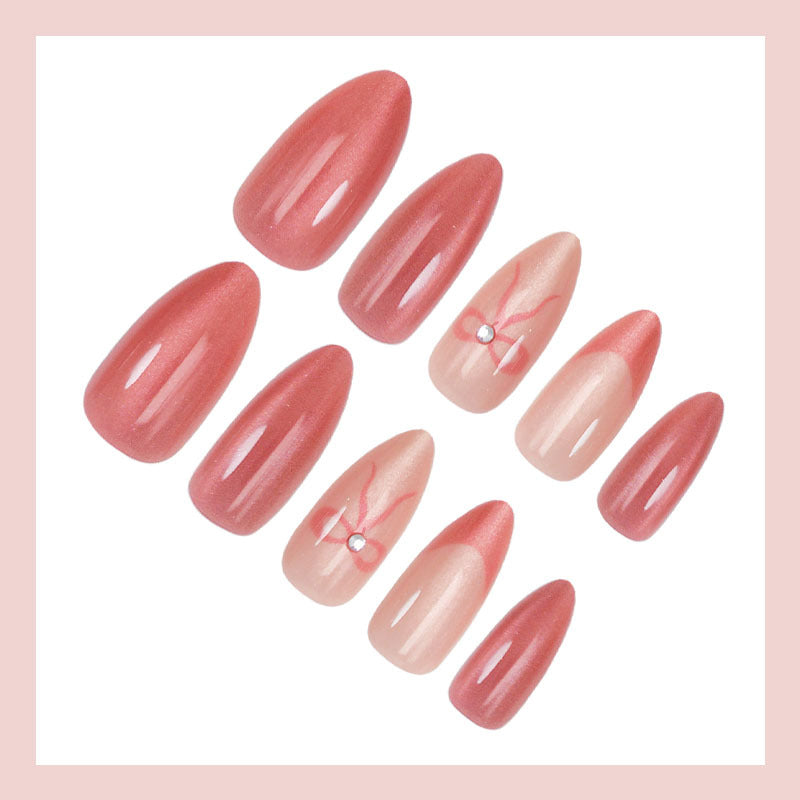 Kunstnagelset mit eleganten Schleifen und Glitzer Brehn