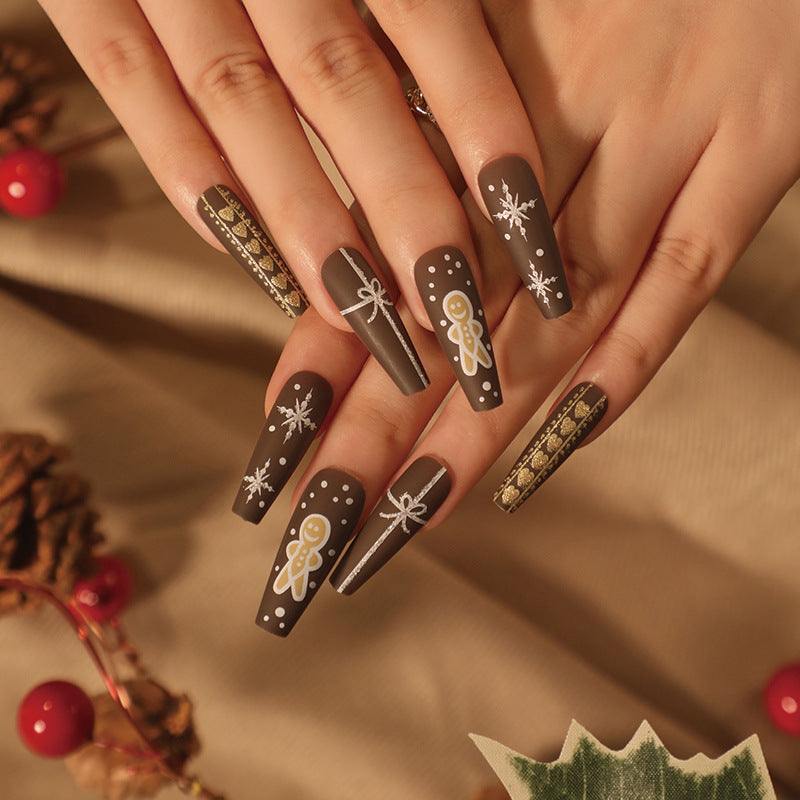 Künstliche Nagelkunst mit festlichem Lebkuchen-Design Brehn