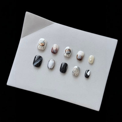 Künstlerisches Press-On Nagel-Set mit eleganten Designs