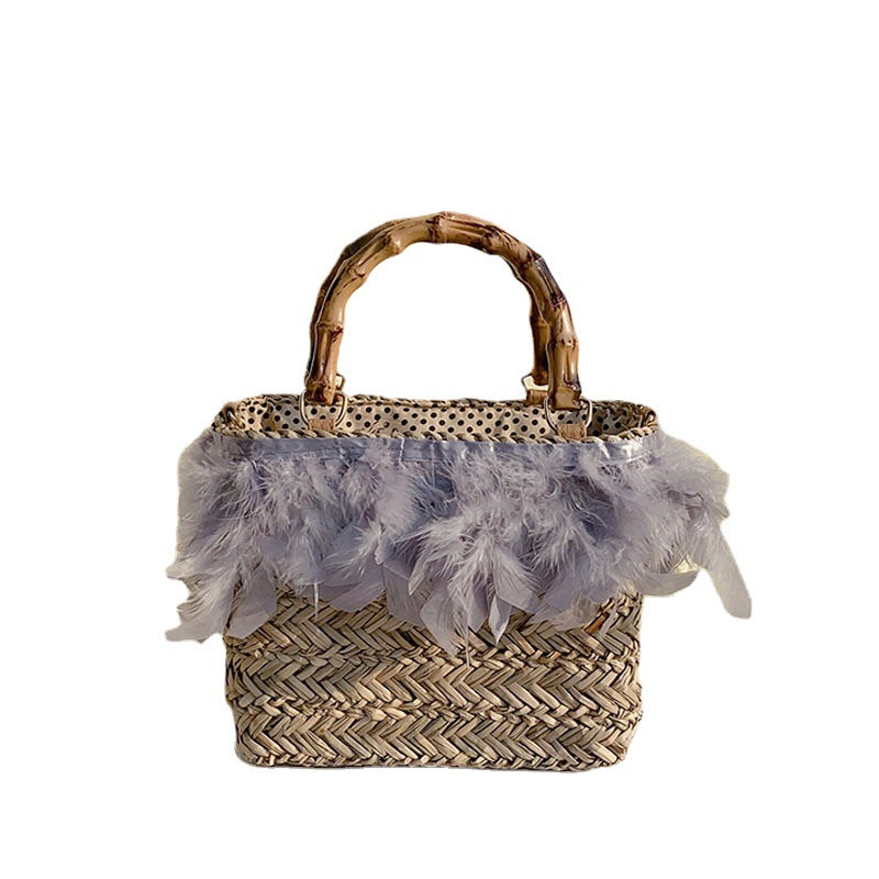 Elegante Handtasche mit Federn und Bambusgriffen Brehn