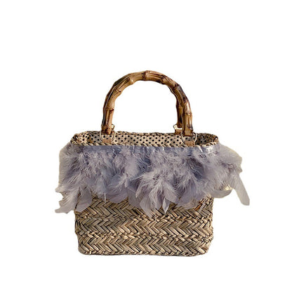 Elegante Handtasche mit Federn und Bambusgriffen Brehn