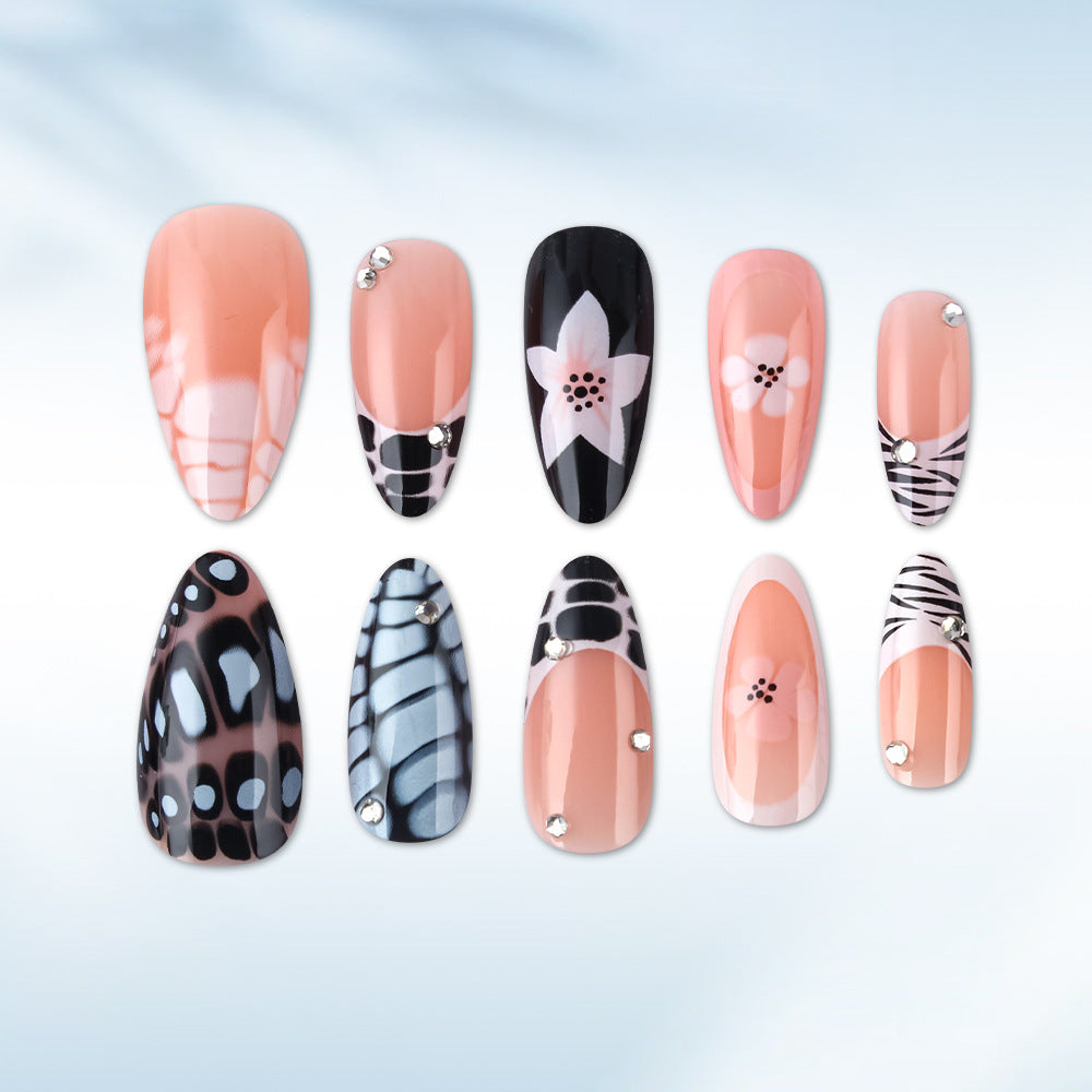 Künstlerisches Press-On Nagelset mit floralem und texturiertem Design Brehn