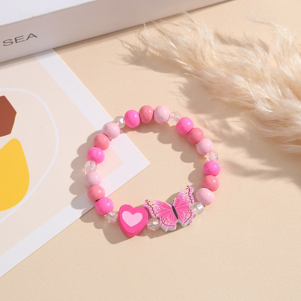 Verspieltes Armband mit Herz- und Schmetterlings-Anhängern Brehn