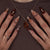 Kunstnagelset mit floralen und glamourösen Verzierungen Brehn