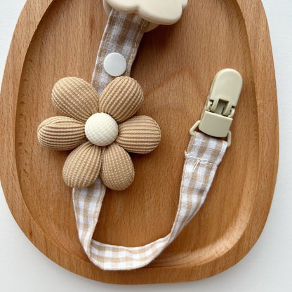 Blumenkleidungs-Schnullerclip mit Gingham-Baumwollgurt