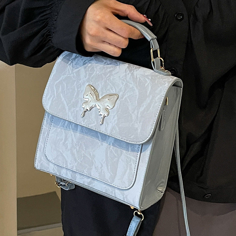 Schmetterlingsverzierte Handtasche