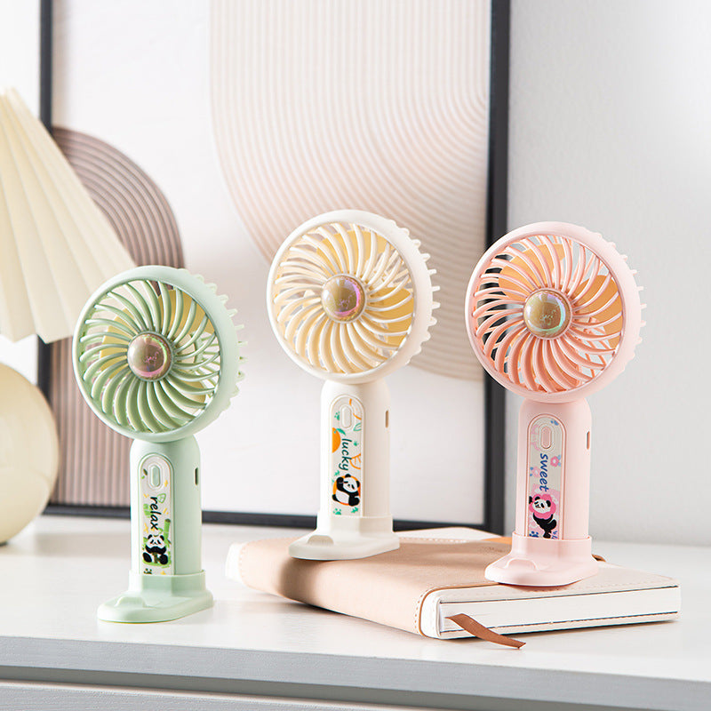 Tragbarer Handheld-Fan im Cartoon-Stil Brehn