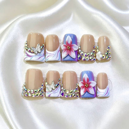 Dekoratives florales Nagelkunstset mit Strassteinen