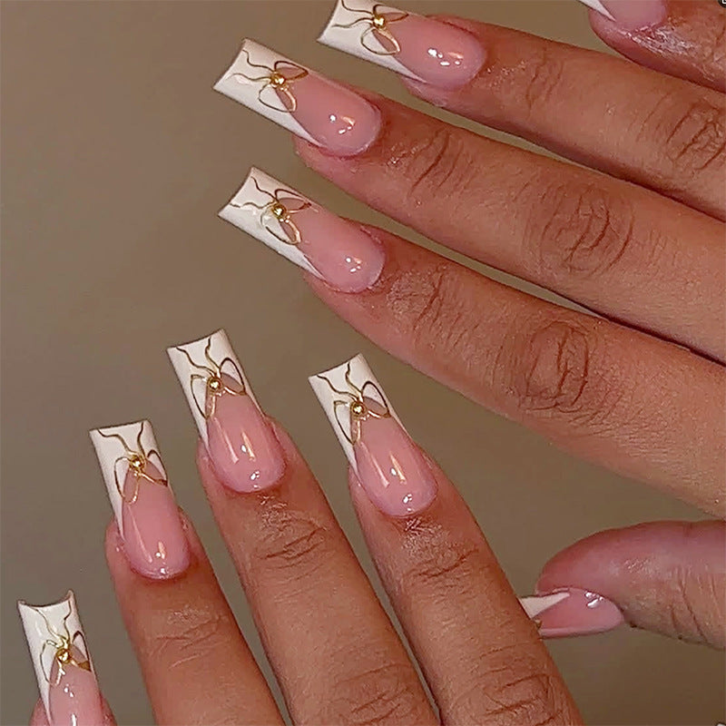 Dekorativer Press-On Nail Set mit künstlerischen Schleifen Designs Brehn