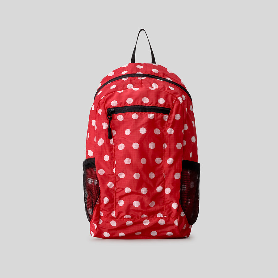 Verspielt gepunkteter Rucksack