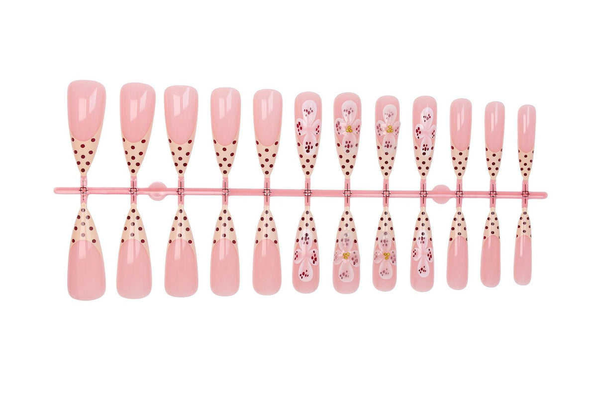 Kunstnagelset mit eleganten Blüten- und Punktemotiven Brehn