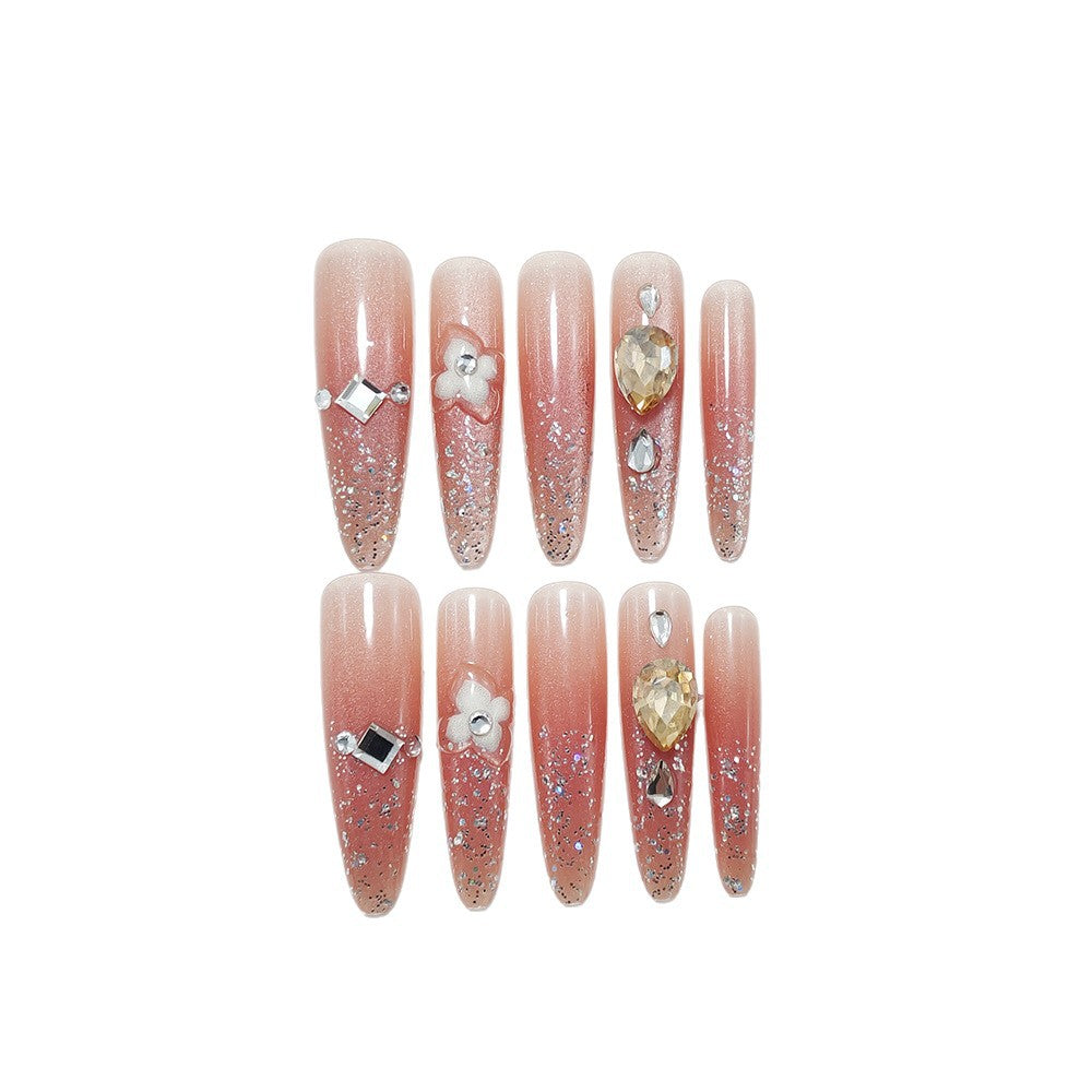 Glänzende Kunstnägel mit Strass und Glitter Brehn