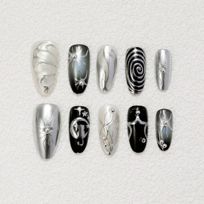 Kunstnägel mit Metallic-Effekten und komplexen Designs Brehn