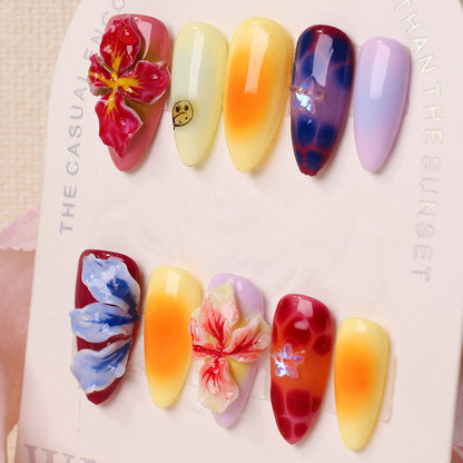 Kunstnagelset mit floralen 3D-Akzenten und bunten Designs Brehn